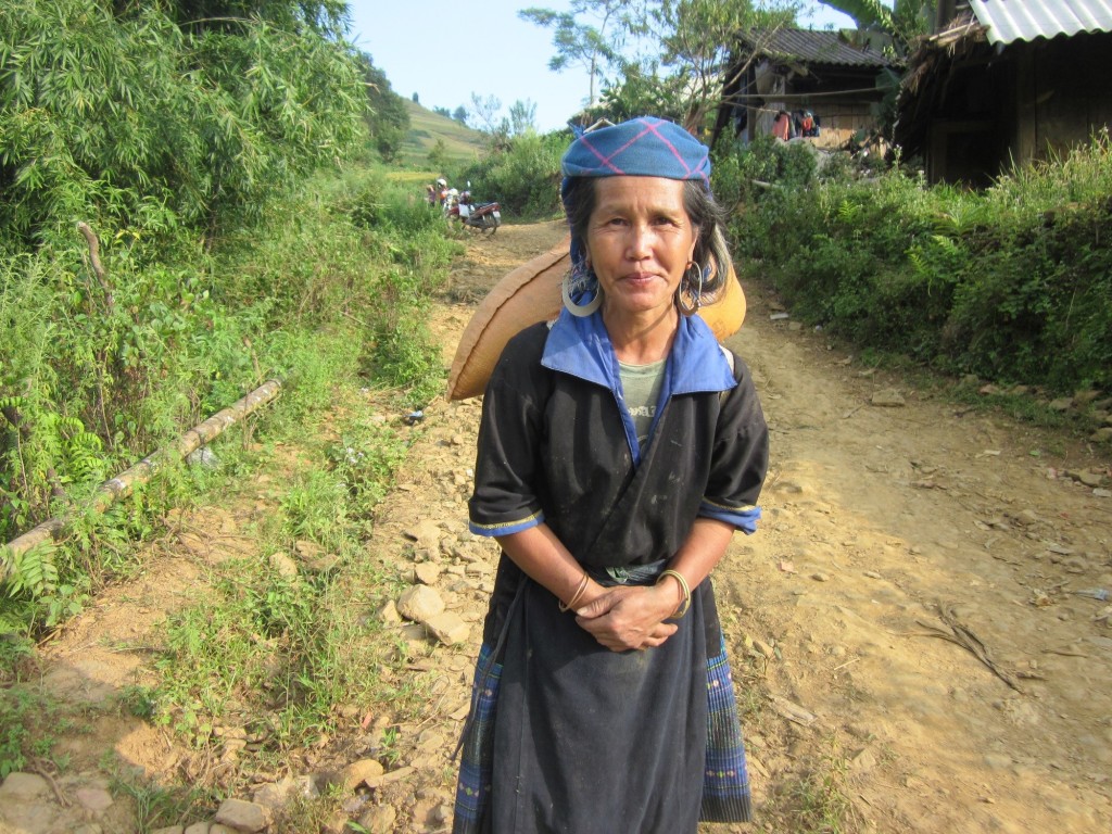 A Black H'Mong woman wearing her traditional costume